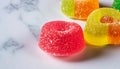 macro shot of jelly candies on white marble table