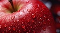 Macro-shot of a juicy red apple with a dew drop on its surface