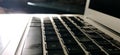 Macro shot of laptop keypads basking in the light of the morning sun Royalty Free Stock Photo