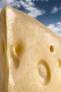Macro shot of a large slice of emmental cheese Royalty Free Stock Photo