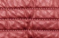Macro shot leather texture background. Part of red perforated leather details. Perforated leather texture background. Texture Royalty Free Stock Photo