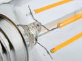 Macro shot of LED Filament type lamp from the base side on white background Royalty Free Stock Photo
