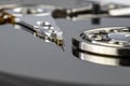 Macro shot of a magnetic needle on a hard disk platter, open HDD disk, perfectly clean surface. Royalty Free Stock Photo