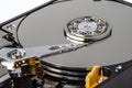 Macro shot of a magnetic needle on a hard disk platter, open HDD disk, perfectly clean surface. Royalty Free Stock Photo