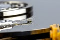 Macro shot of a magnetic needle on a hard disk platter, open HDD disk, perfectly clean surface Royalty Free Stock Photo