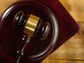 Macro shot. Mahogany judge`s gavel. Isolated on a wooden background. A symbol of a fair and honest trial. Courtroom, auction. Royalty Free Stock Photo