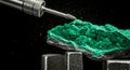 Macro shot of malachite carving with rotary tool Royalty Free Stock Photo