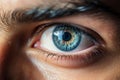 Macro shot of male human blue eye