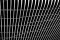 Macro shot of metal mesh in front of a black surface
