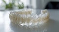 Macro shot of molars and a transparent orthodontic retainer emphasizing dental care and orthodontic treatment.