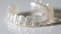 Macro shot of molars and a transparent orthodontic retainer emphasizing dental care and orthodontic treatment.