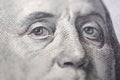 Macro shot of a new 100 dollar bill, look of US president Benjamin Franklin. 100 dollar bill with a close-up look of US Royalty Free Stock Photo