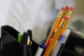 Macro shot of office supplies pens and pencils at a desk Royalty Free Stock Photo