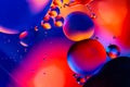 Macro shot of oil bubbles with water on colorful background. Space and universe planets styled psychedelic abstract image Royalty Free Stock Photo