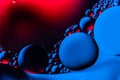 Macro shot of oil bubbles with water on colorful background. Space and universe planets styled psychedelic abstract image Royalty Free Stock Photo