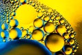 Macro shot of oil bubbles with water on colorful background. Space and universe planets styled psychedelic abstract image Royalty Free Stock Photo