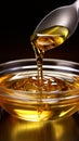 Macro shot of olive oil being poured delicately into a gleaming spoon