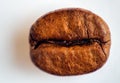 Macro shot of one coffee roasted bean isolated on white background Royalty Free Stock Photo