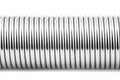 A macro shot of one new steel spring, isolated on a white background. Royalty Free Stock Photo