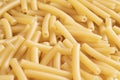 Macro shot pasta noodles texture. Macaroni background pattern. Top view. Dry pasta for cooking. Abstract italian macaroni