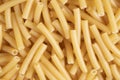 Macro shot pasta noodles texture. Macaroni background pattern. Top view. Dry pasta for cooking. Abstract italian macaroni