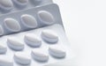 Macro shot of pills in white blister pack for light resistance