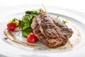 Pork Neck Steak with Mixed Salad on White Restaurent Plate Royalty Free Stock Photo