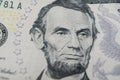 Macro shot Portrait of Abraham Lincoln on the one five dollar bill. Background of the money. 5 dollar bill with Abraham Lincoln