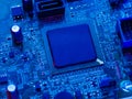 Macro shot of a processor, printed circuit board or computer motherboard inside an electronic device. Technological background. Royalty Free Stock Photo