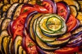 macro shot of a ratatouille dish, with the focus on the beautiful and intricate pattern created by the sliced vegetables