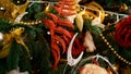 Macro shot of red and golden Xmas decorations and garlands on Christmas tree Royalty Free Stock Photo