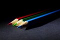 Macro Shot of Red, Green and Blue Sharpened Colorful Pencils Against Black Background Royalty Free Stock Photo