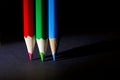 Macro Shot of Red, Green and Blue Sharpened Colorful Pencils Against Black Background Royalty Free Stock Photo