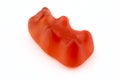 A macro shot of a red gummy bear, isolated on a white background. Royalty Free Stock Photo