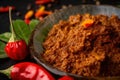 Macro shot of Rendang curry paste, made from a blend of flavorful spices, chili peppers, and coconut milk