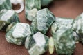 Macro shot of serpentine crystals in necklace. Natural, beautiful gemstones. Royalty Free Stock Photo