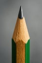 Macro Shot of a Sharpened Green Pencil Tip Ready for Drawing or Writing on a Gray Background Royalty Free Stock Photo