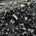 Macro photography reveals striking black tourmaline crystal cluster with contrasting pale inclusions beautifully formed. Royalty Free Stock Photo