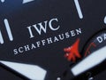 Macro shot of the sign "IWC" on a Watch