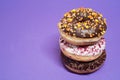 Macro shot of stack of donuts over purple background Royalty Free Stock Photo