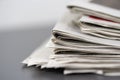 Macro shot of a stack of newspapers. The newspapers are folded Royalty Free Stock Photo