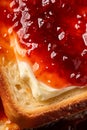 Macro shot of toasted bread with butter and homemade raspberry jam. Delicious breakfast