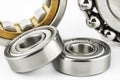 Macro shot of two ball bearings, isolated on a white background, selective focus. Royalty Free Stock Photo