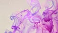 A macro shot of two colors of watercolor paint mixing and diffusing into each other creating a soothing blend..
