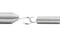 Macro shot of two new linked springs, isolated on a white background. Royalty Free Stock Photo