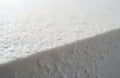 Macro shot uneven surface of white foam packaging material. Protective styrofoam surface with rough grainy texture. Abstract Royalty Free Stock Photo