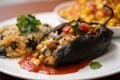 Macro shot of vegetarian Chiles Rellenos stuffed with black beans and sweet corn, served with a zesty salsa on the side