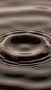 Macro Shot of Water Droplets Creating Ripples on Dark Liquid Surface with Bright Particle Reflections in Dramatic Royalty Free Stock Photo
