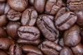 Macro shot of whole bean organic smooth medium dark roast coffee from Sumatra on burlap