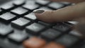 Macro shot of Womans fingers using a large button calculator